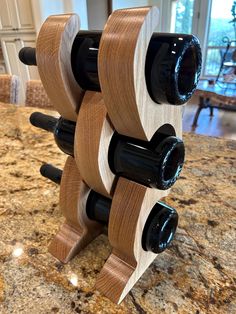 Custom crafted solid white oak hardwood wine rack. This beautiful wine rack is a simple yet elegant addition to any home. This rack is available for immediate delivery. Made from solid oak hardwood planks. This wine rack is designed to hold 3 bottles of your favorite wine with a very small footprint of 6 1/4"x 8". The height is 14 1/2". The finish is four coats of crystal clear lacquer We take special care in packaging our custom wood items.  This item ships free in the US (lower 48 states).  For other locations, please inquire regarding any additional shipping costs. We ship worldwide and can provide a custom quote for your location.   design and photograph © flowcraftstudios 2024 Oak Wine Rack, Location Design, Beer Storage, Wine Stand, Wood Items, Wood Wine Racks, Small Woodworking Projects, Project Board, Oak Hardwood