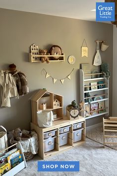 a child's playroom with toys and bookshelves on the wall above it