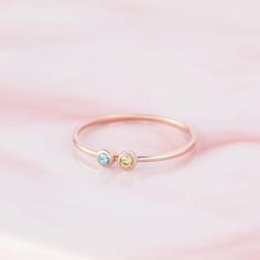 "♥ Family Birthstone Ring ♥ Customed by kids' birthstones, this beautiful and dainty ring is a perfect gift for your mom or your loved one. P R O D U C T ∙ I N F O * Material: Solid 925 Sterling Silver * Finishing: Silver - Yellow Gold - Rose Gold * Up to 5 stones * Each stone measures approx. 1/16'' (2mm) H O W * T O * O R D E R 1. Select the drop-down option you want 2. Please let us know the following information in the \"Add your personalization\" box or \"Note to Seller\" box: - The birthst Family Birthstone Ring, Birthstone Ring Mothers, Birthstone Stacking Rings, Family Ring, Jewelry For Mom, Family Rings, Mom Ring, Birthstone Rings, Fingerprint Jewelry