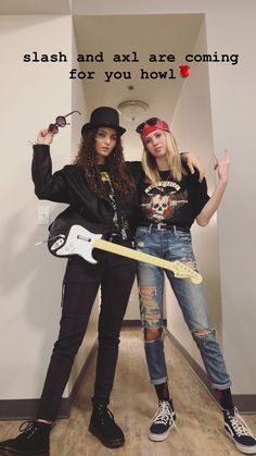 two young women posing for a photo in front of a sign that says slash and slay are coming for you how?