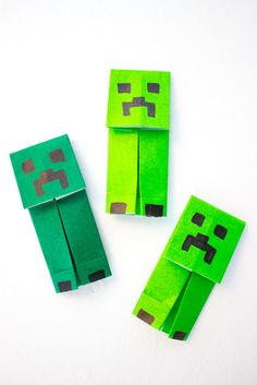 three pieces of paper made to look like minecraft creepers