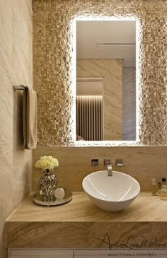 a bathroom sink sitting under a large mirror