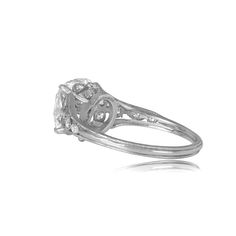 A remarkable cushion cut diamond ring that centers a GIA-certified 4.24-carat antique cushion cut diamond, G color, and VS2 clarity. Along the shoulders of this ring are old-cut diamonds set in round and marquise-shaped bezels. This ring is platinum and the shank has milgrain around the sides.
The measurements of this center diamond are 9.57mm x 9.26mm x 6.35mm.
A copy of the GIA certificate of the center diamond is available upon request.
This ring has a low profile, considering the depth of the diamond.
If you have any questions about this ring, please feel free to contact us. Antique Cushion Cut Diamond Ring, Antique Cushion Cut Diamond, Antique Cushion Cut, Estate Diamond Jewelry, Antique Cushion, Belt Ring, Cushion Cut Diamond Ring, Cushion Cut Diamond, Engagement Ring Diamond Cut