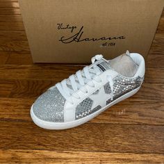 Vintage Havana Style: Carla Checkered Fashion Sneakers Color: Silver Glitter Size: Women’s Size 8 Medium Features: Glitter Covered Metallic Design Removable Footbed Pull On Tab Round Toe Lace Up Closure New In The Box Smoke & Pet Free Home Shipping Daily: Monday - Friday Bundle Your Likes For A Private Offer Please Ask Questions Silver Sparkling Lace-up Sneakers, Casual Silver Glitter Sneakers, Silver Lace-up Party Sneakers, Silver Rhinestone Low-top Sneakers, Trendy Silver Slip-on Sneakers, Silver Sparkling Sneakers With Round Toe, Silver Glitter Casual Sneakers, Silver Glitter Lace-up Sneakers, Silver Sparkling Party Sneakers