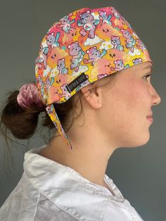 Care Bears Pink Scrub Cap - handmade from 100% cotton fabric and is fully lined. The elastic back with ties are adjustable for a more comfortable fit. UNISEX DESIGN  Pattern placement may vary Sizes:  S-M Fits most approx 58cm diameter M-L Fits most and those with longer hair approx 60cm diameter CARE INSTRUCTIONS Warm Hand wash or cool machine wash on gentle cycle. DO NOT tumble dry or dry clean. Adjustable Multicolor Cotton Bandana, Rose Bears, Scrub Caps Pattern, Pink Scrubs, Nursing Accessories, Cap Patterns, Scrub Cap, Care Bears, Scrub Caps