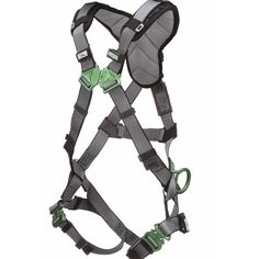 an adjustable harness with green buckles on the front and back straps, attached to a white background