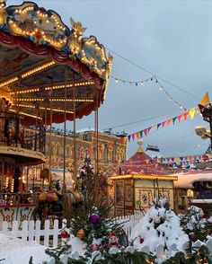 the merry go round is decorated with lights and decorations