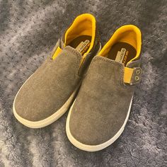 New Boys Skechers Memory Foam Slip On Loafer In Sz11. They Are Super Cute With Tons Of Style. Light Brown With Yellow Trim So Very Versatile. Can Be Dressed Up Or Down. My Son Refused To Wear Any Shoes Except Red Nikes So These Never Left The Shelf. All Items Come Washed Unless Nwt Or Nwot. Smoke Free Home. Like It? Make An Offer Or Ask Any Questions. Thank You! Casual Yellow Closed Toe Slip-ons, Yellow Slip-ons With Rubber Sole, Yellow Slip-ons With Round Toe, Yellow Casual Slip-resistant Sneakers, Yellow Round Toe Slip-ons, Casual Yellow Slip-resistant Sneakers, Yellow Round Toe Sneakers For School, Casual Slip-on Canvas Shoes For School, Yellow Casual Slip-on Sneakers With Round Toe