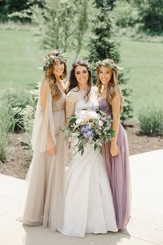 three bridesmaids pose for a photo together