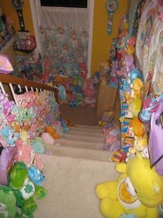 there are many stuffed animals on the stairs in this room, including teddy bears and other toys