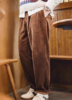 Looking for a pair of trousers that bring both style and comfort? The American Retro Heavy Corduroy Double Pleated Drape Cotton Men's Trousers are your new go-to. These corduroy pants add a classic touch to any outfit, perfect for when you want to keep it casual yet stylish. With their rich texture and double pleats, they offer a sophisticated look without feeling stiff or uncomfortable. Made from 100% cotton, these trousers feel soft and breathable, making them perfect for spring and fall. The straight fit gives you the freedom to move comfortably, whether you’re out for a casual day or just relaxing at home. Plus, the middle waist sits just right, so you don’t have to worry about discomfort throughout the day. Available in timeless beige and brown, these trousers pair easily with your fa Corduroy Pants Outfit Mens, Corduroy Pants Outfit, Sneaker Dress Shoes, Skirt Co Ord, Corduroy Pants, Mens Trousers, Pants Outfit, Canvas Shoes, Spring And Fall