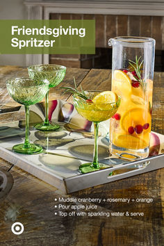 a tray that has some glasses on it with fruit in them and the words, friends giving spritzer