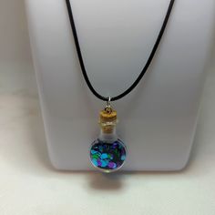 This Is A Tiny Glass Vial Filled With Purple, Green, And Aqua Glitter. Necklace Is Approximately 17-19". On Vegan Cord. Purple Glitter Party Jewelry, Iridescent Adjustable Necklace For Party, Glitter Necklace, Vial Necklace, Pick Your Poison, Night Swimming, Glass Vials, Hand Crafted Jewelry, Crafted Jewelry