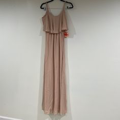 The Caitlin Ruffle Maxi Dress Dusty Blush Crisp And Flows From Top To Bottom. She's Extremely Versatile, So Wear Her As A Classic Spaghetti Strap Or Make Her Into A Cold Shoulder! Spring Bridesmaid Ruffle Dress With Ruffle Hem, Spring Bridesmaid Ruffle Dress, Spring Bridesmaid Fitted Ruffle Dress, Summer Fitted Bridesmaid Ruffle Dress, Beige Flowy Tiered Maxi Dress, Summer Bridesmaid Ruffle Dress, Bridesmaid Maxi Dress With Ruffle Hem, Summer Evening Flowy Ruffle Dress, Sleeveless Beige Maxi Dress With Ruffle Hem