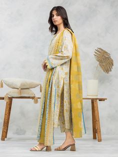 Brand: edenrobe Product: EWU24A1-29046-3PCollection: Allure Lawn Unstitched - Spring Summer CollectionFabric: Lawn DESIGN DETAILS: 3M Printed Lawn Shirt 2.5M Printed Lawn Dupatta 1.8M Dyed Trouser DISCLAIMER:* Lining, Laces, and Tassels are not included in unstitched variants.* Embellishment items in stitched outfits are subject to market availability.* The actual colors of the outfit may vary from the colors being displayed on your device. CARE INSTRUCTIONS: Extra Fabric Has Been Used For Shoot Original Color May Vary Slightly From The Picture Dry Clean Recommended Iron The Clothes At Moderate Temperature Do Not Use Bleach, Or Stain Removing Chemicals Damp Fabric Should Not Be Exposed To Sunlight edenrobe Allure Lawn Spring Summer Collection Authenticity Guaranteed – 100% Original Brand 3 Yellow Sets With Sheer Dupatta And Long Sleeves, Yellow Long Sleeve Set With Sheer Dupatta, Yellow Long Sleeve Sets With Sheer Dupatta, Yellow Cotton Sets With Sheer Dupatta, Elegant Cotton Suit For Eid, Elegant Yellow Sets With Printed Motifs, Yellow Printed Cotton Silk Sets, Yellow Cotton Silk Sets With Printed Motifs, Yellow Cotton Silk Dress For Eid