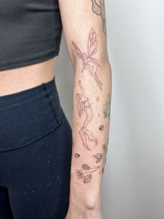 a woman with a tattoo on her arm