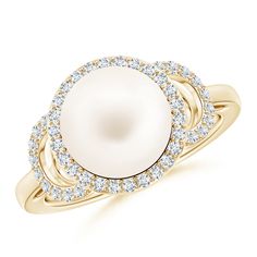 Sculpted in 14K yellow gold, this pearl solitaire ring has a round Freshwater cultured pearl nestled in a girdle of glistening diamonds. On the shoulders of this halo pearl ring there are precious diamonds arranged in a half moon pattern that remarkably enhance the stunning pearl. Pearl Halo Ring, Pearl Halo, Cultured Pearl Ring, Moon Pattern, Pearl And Diamond Ring, Freshwater Cultured Pearls, Halo Ring, Halo Rings, Half Moon