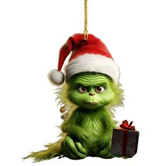 the grinch is holding a christmas present