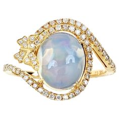 Stunning, timeless and classy eternity Unique Ring. Decorate yourself in luxury with this Gin & Grace Ring. The 14K Yellow Gold jewelry boasts with Oval-cab Ethiopian Opal (1 pcs) 0.49 carat and Natural Round-cut white Diamond (70 Pcs) 0.36 Carat accent stones for a lovely design. This Ring is weight 3.08 grams. Crafted with 14K Yellow Gold, this delicate Ring is polished to a high finish shine. Yellow Gold Cocktail Ring, Ethiopian Opal Ring, Gold Cocktail Ring, Gold Cocktail, Yellow Gold Jewelry, Delicate Rings, Natural Opal, Opal Jewelry, Real Diamonds