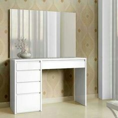 a white desk with drawers and a mirror