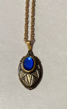 "This is for a beautiful layered Victorian Look Pendant. Oval Brass pendant with a Blue color Glass stone accent 1 1/2\" long x 1\" wide Inspired by the \"Golden Era\" 23\" gold Plate rope Chain Thanks for looking" Blue Medallion Jewelry With Adjustable Chain, Blue Oval Locket Necklace, Oval Blue Locket Necklace, Antique Blue Brass Jewelry, Blue Pendant Locket Necklace, Antique Blue Necklace For Gift, Blue Medallion Locket Necklace, Formal Blue Locket Jewelry, Vintage Blue Oval Pendant Necklace