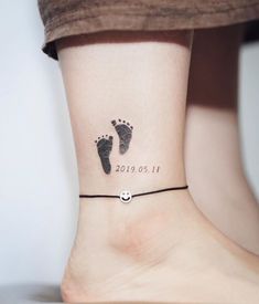 a woman's foot with a tattoo on her ankle that reads, 2013 01 11