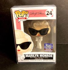 marilyn monroe pop vinyl figure with sunglasses on it's head, in a box