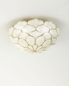 a white ceiling light hanging from the ceiling