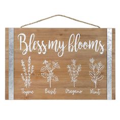 a wooden sign that says,'blessing my blooms'and five different types of flowers