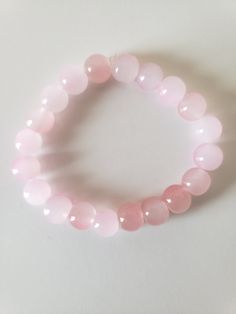 Selling bracelets 3-5$ Small bussines !! Follow my tiktok its dannaxplays Pink Rose Quartz Stretch Bracelet, Pink Rose Quartz Round Stretch Bracelet, Casual Rose Quartz Bracelets For Gifts, Adjustable Pink Rose Quartz Stretch Bracelet, Casual Adjustable Rose Quartz Bracelets, Adjustable Casual Rose Quartz Bracelets, Casual Pink Crystal Round Beads Bracelet, Trendy Pink Wristband With Round Beads, Casual Pink Rose Quartz Jewelry