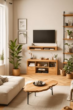 a living room filled with furniture and a flat screen tv mounted on a wall above a wooden coffee table