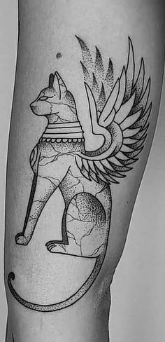 a black and white photo of a tattoo on the leg