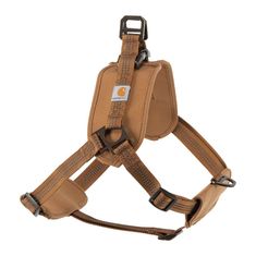 the dog harness is made from brown leather and has an adjustable buckle on it's side