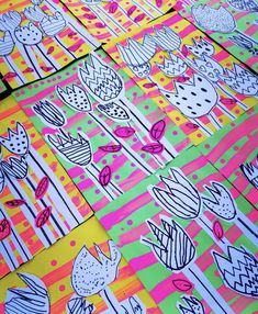 several different colored papers with cactus designs on them and one has pink, green, blue, yellow, and orange stripes