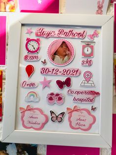 a white frame filled with lots of pink and white magnets