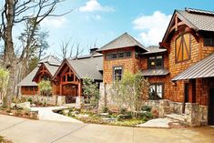 a large house with lots of wood and stone