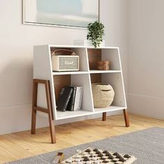 a white book shelf with books on it