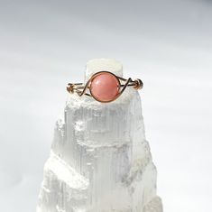 Please read before ordering: Listing is for one (1) pink opal ring Wire available: Silver or Gold plated (tarnish resistant) Bead size: 6mm Ring sizes available: 3-13.5 All rings are fully customizable, handmade + made to order. Current turn around time for rings are 1 1/2 - 2 weeks, feel free to contact me directly if you need the product by a certain date as a gift/for an event. Jewelry care: - Avoid contact with water as much as possible, water will not damage the ring although may dull the s Crystal Wire Wrapped Ring, Pink Opal Ring, Chakra Gifts, Healing Crystal Ring, Lavender Amethyst, Ring Wire, Artistic Wire, Ring Crystal, Wire Wrapped Ring