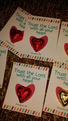 four valentine's day cards with heart shaped foils on them, and the words trust the lord with your heart