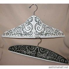 two hangers with black and white designs on them