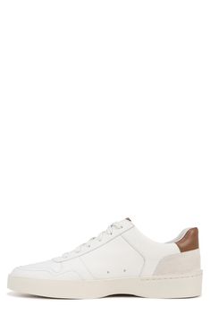 A sleek suede upper and leather accents add sporty appeal to this minimalist sneaker with tonal laces and a grippy rubber sole. Lace-up style Leather upper and lining/rubber sole Imported Mid-top Slip-on Sneakers With White Sole For Sports, Functional Slip-on Sneakers With Textured White Sole, White Slip-on Sneakers With Textured Sole For Running, Medium Fit Lace-up Sneakers With White Sole, White Fade-resistant Leather Sneakers, Minimalist Sneakers, Sneaker Men, Leather Accents, Fabric Gift Bags