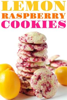 lemon raspberry cookies stacked on top of each other next to two lemons