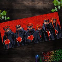 a mouse pad with an image of five people in black robes and red flowers on them