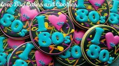 decorated cookies are arranged in the shape of i love 80's and 90's