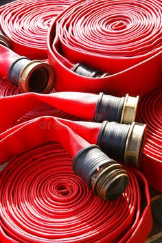 red fire hoses are lined up on the floor royalty images, stock photos & more