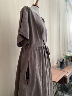 Linen midi dress with pockets and belt. Size Chart for Guidance: XXS Bust: fits bust around 80 cm / 31.5" Waist: fits waist around 62 cm / 24.5" Hips: fits hips around 88 cm / 35" XS Bust: fits bust around 84 cm / 33" Waist: fits waist around 66 cm / 26" Hips: fits hips around 92 cm / 36" S  Bust: fits bust around 88 cm / 35" Waist: fits waist around 70 cm / 27.5" Hips: fits hips around 96 cm / 38" M Bust: fits bust around 96 cm / 38" Waist: fits waist around 78 cm / 30.75" Hips: fits hips aroun Summer Belted Dress With Fitted Waist, Casual Knee-length Belted Dress, Casual Knee-length Dress With Belt, Fitted Brown Dress With Belt, Spring Midi-length Belted Dress With Pockets, Chic Mid-length Dresses With Pockets, Summer Knee-length Dress With Belt, Spring Short Sleeve Belted Dress With Pockets, Belted Linen Midi Dress For Daywear