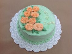 a cake with frosting and flowers on it