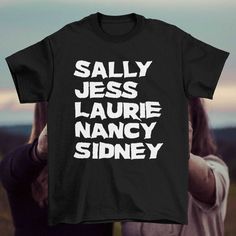 someone holding up a t - shirt that says salty jesus, laurie nancy sidney