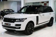 the white range rover is on display at an auto show