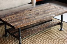 a wooden coffee table sitting on top of a rug